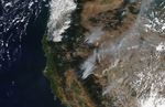 Western wildfires grow, but better weather helps crews